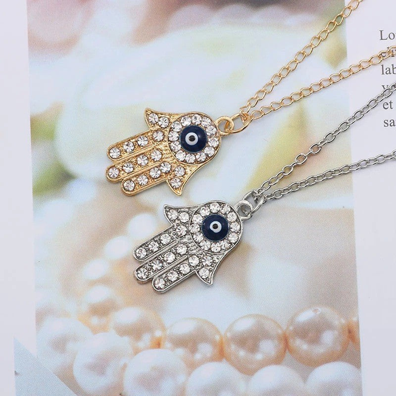 Gold-plated hand chain with rhinestone accents - vintage-inspired pendant featuring an eye and palm design - wholesale from manufacturer