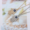 Gold-plated hand chain with rhinestone accents - vintage-inspired pendant featuring an eye and palm design - wholesale from manufacturer