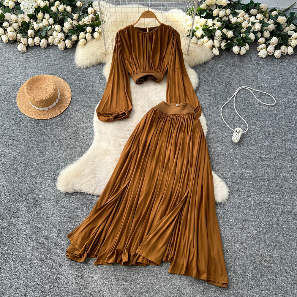 French style women's autumn outfit: elegant cinched-waist cropped lantern sleeve blouse with high-waisted, flowy slit midi skirt two-piece set