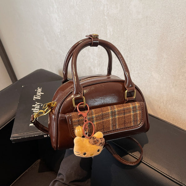 Niche retro hand-carried shell bag women's 2025 autumn new contrasting color fashion shoulder bag high-end versatile women's bag