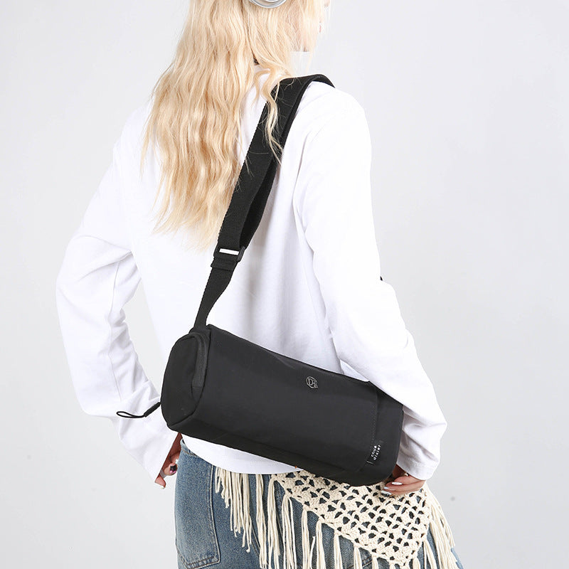 Simple Japanese shoulder bag women's nylon anti-splashing cylinder pillow bag trendy cool messenger bag commuter portable handbag