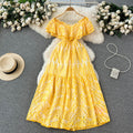 Elegant, sophisticated, and effortlessly chic: this ruffled, off-the-shoulder, lace-embroidered, and cutout maxi dress is perfect for a glamorous beach vacation