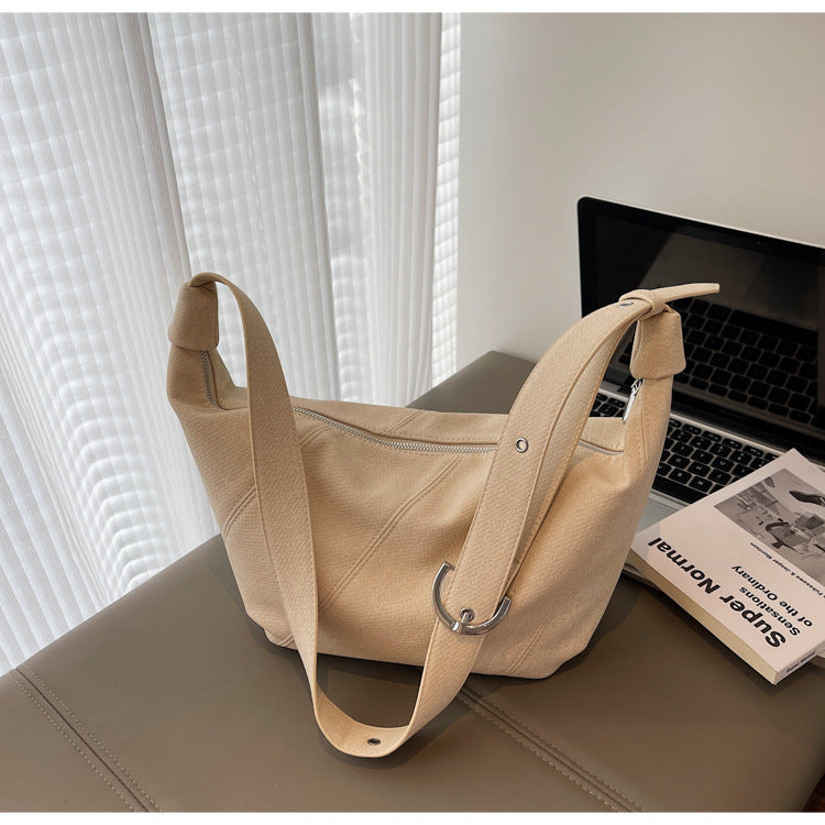Cross-border solid color dumpling bag 2025 new Korean version fashionable simple shoulder bag niche temperament commuter messenger bag