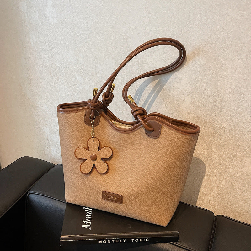 Hand carry versatile bucket bag women's bag 2025 new fashion texture shoulder bag casual foreign style messenger bag