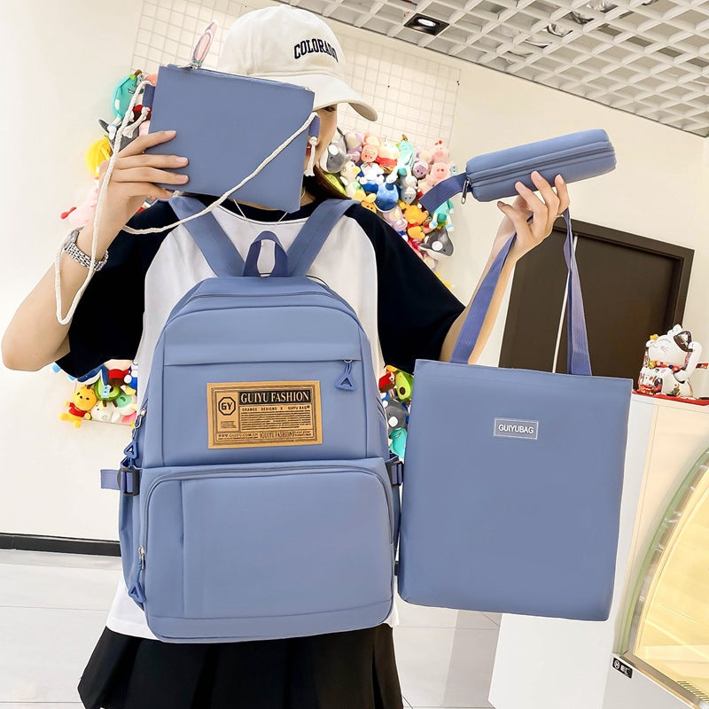 New primary and junior high school student schoolbag portable make-up bag four-piece Korean version simple backpack trendy campus backpack