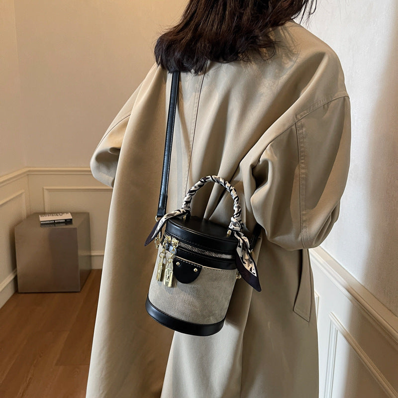 Retro contrasting color bucket bag women's 2025 new niche design portable cylinder bag versatile texture shoulder messenger bag
