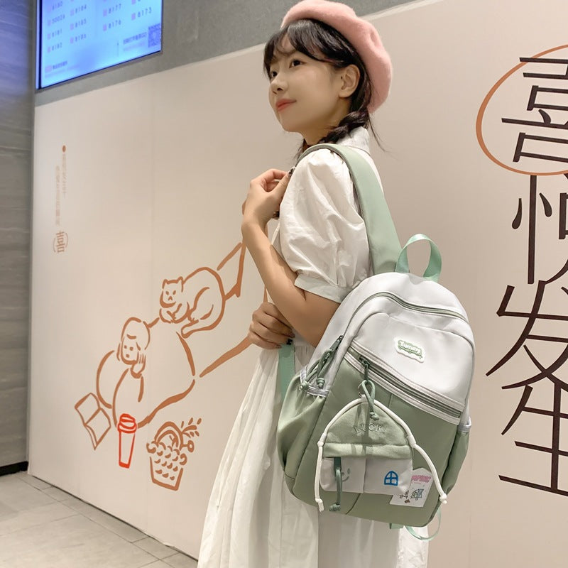 College student schoolbag, junior high school student backpack, women's summer Korean style fashion, large capacity and light high school travel backpack tide