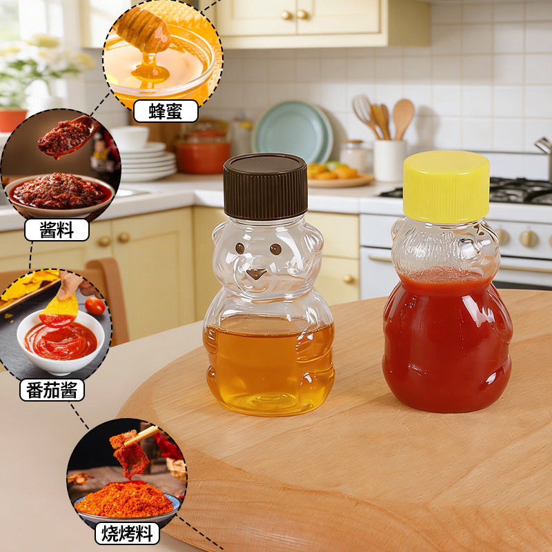 hot seller: bear-shaped clear pp plastic bottles with lids - perfect for juice, drinks, sauces, and honey. airtight sealing