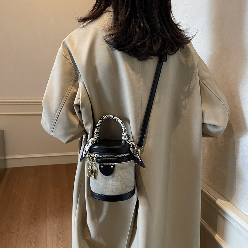 Retro contrasting color bucket bag women's 2025 new niche design portable cylinder bag versatile texture shoulder messenger bag