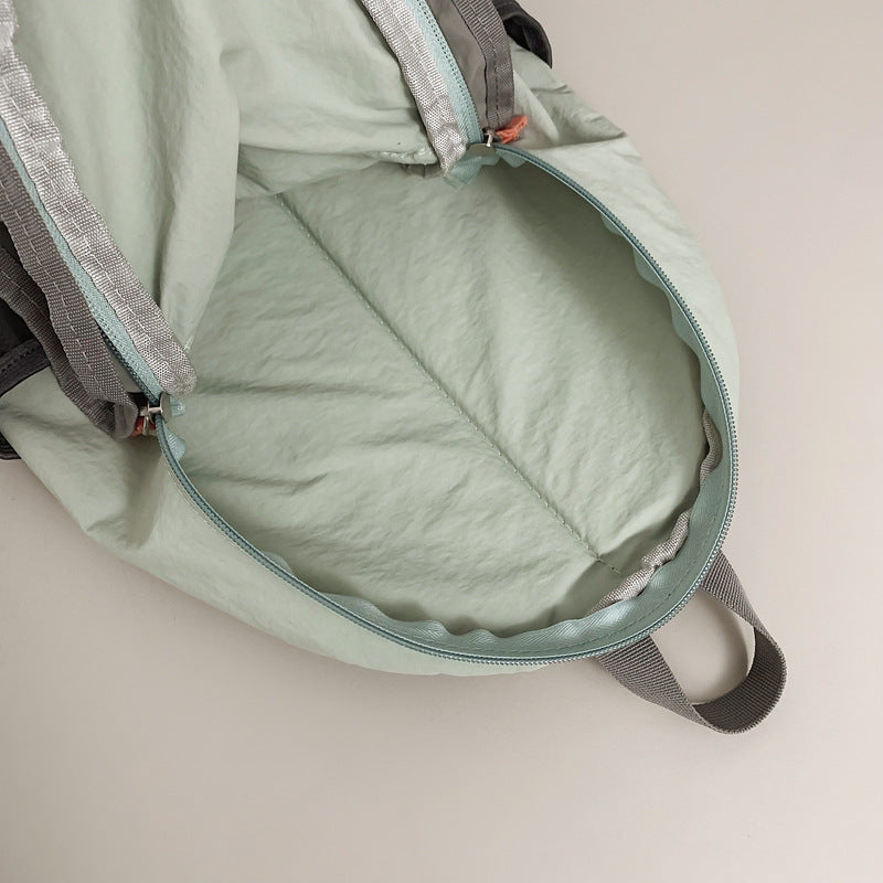 Outdoor casual backpack 2025 new cross strap niche high value backpack couple going out travel bag tide