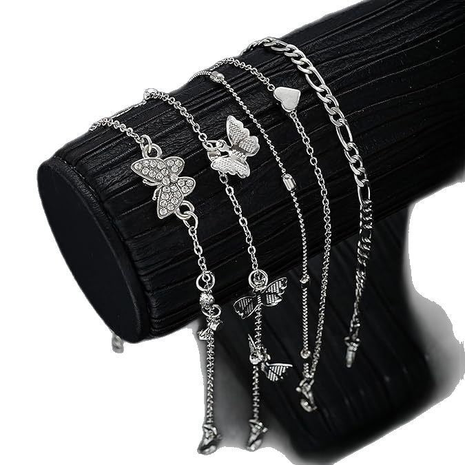"instagram-worthy, understated luxury anklet set featuring butterfly, shell, and seed beads. available in gold and white gold."