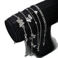 "instagram-worthy, understated luxury anklet set featuring butterfly, shell, and seed beads. available in gold and white gold."