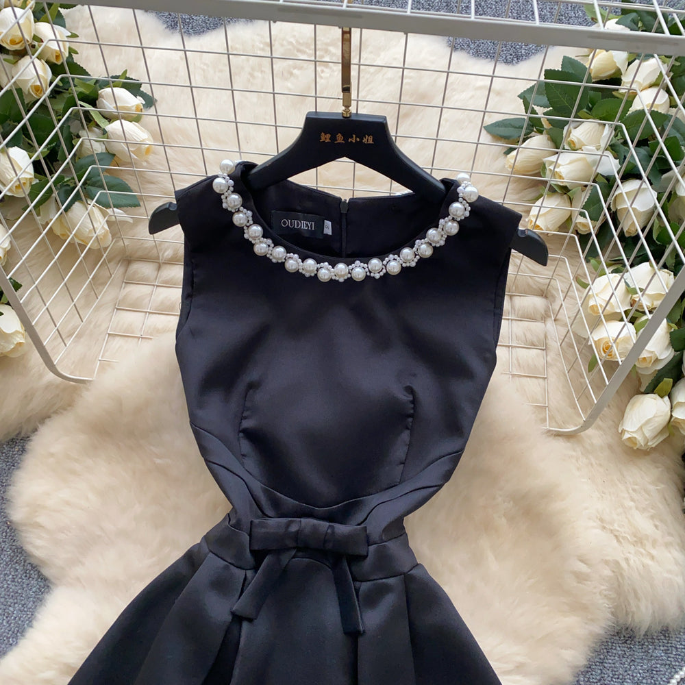 High-end, understated luxury beaded round neck sleeveless dress for women. perfect for summer, this french-inspired dress features a cinched waist, a-line silhouette, and a flattering, voluminous skirt. ideal as an elegant evening gown or special occasion