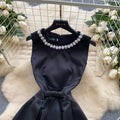 High-end, understated luxury beaded round neck sleeveless dress for women. perfect for summer, this french-inspired dress features a cinched waist, a-line silhouette, and a flattering, voluminous skirt. ideal as an elegant evening gown or special occasion