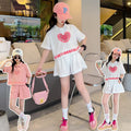 new girls' summer outfit set: stylish and trendy, perfect for older girls. summer-inspired short-sleeve and shorts set with heart-themed polo shirt – a popular choice for kids' summer fashion