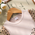 Girls' dress for toddlers and young children, featuring a bow, heart, and polka dot mesh skirt