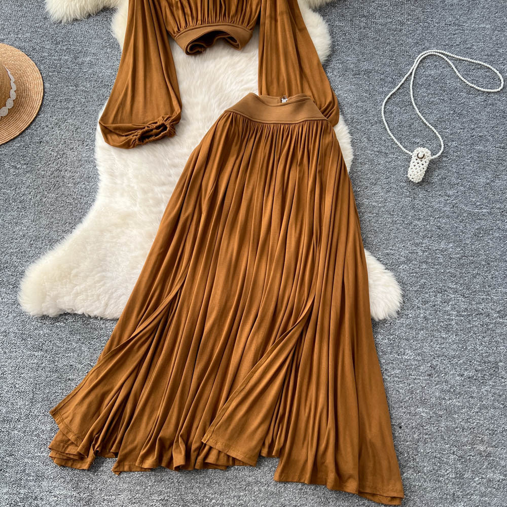French style women's autumn outfit: elegant cinched-waist cropped lantern sleeve blouse with high-waisted, flowy slit midi skirt two-piece set