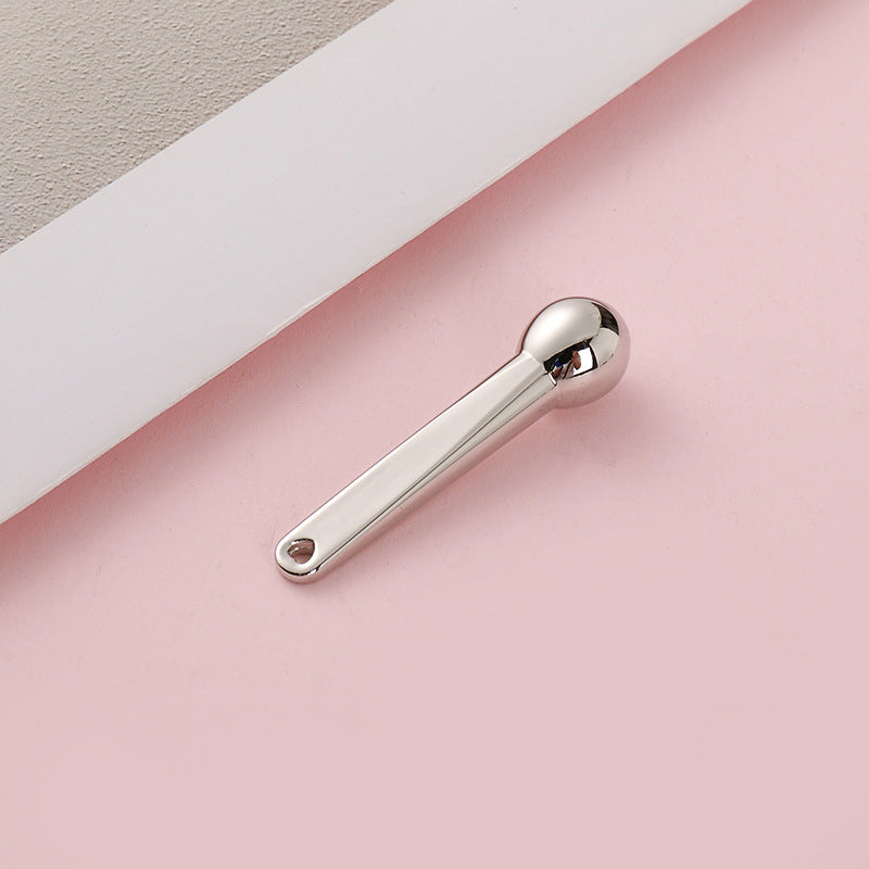 Manufacturer's small hammer dispensing stick, exquisite cosmetics digging metal eye cream massage stick, eye beauty stick