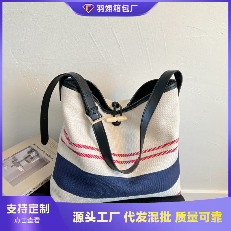 Cross-border striped canvas bag women's large capacity 2025 new summer versatile shoulder messenger bag college student tote bag
