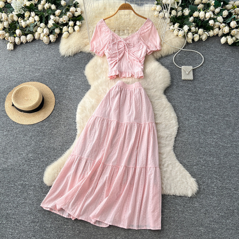 Korean-inspired, stylish and chic women's two-piece set featuring a puff-sleeve, square-neck top and a high-waisted, figure-flattering midi skirt
