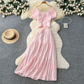 Korean-inspired, stylish and chic women's two-piece set featuring a puff-sleeve, square-neck top and a high-waisted, figure-flattering midi skirt