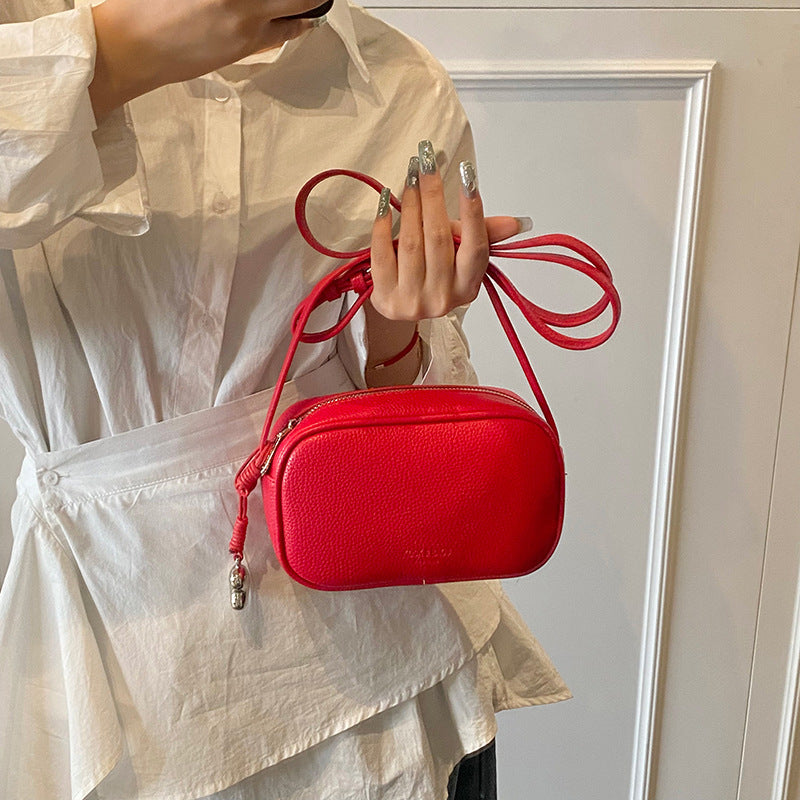 Cross-border high-end fashion foreign-style pillow bag women's 2025 new lychee pattern simple solid color shoulder messenger bag