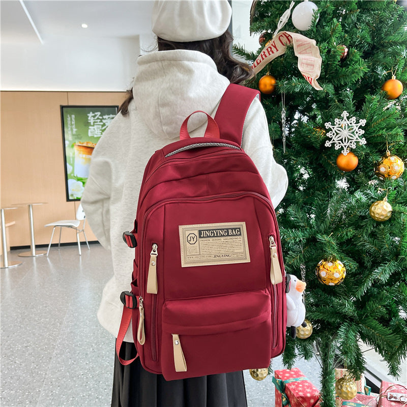 Cross-border wholesale large-capacity leisure backpack versatile burden reduction schoolbag outdoor handbag portable high school backpack