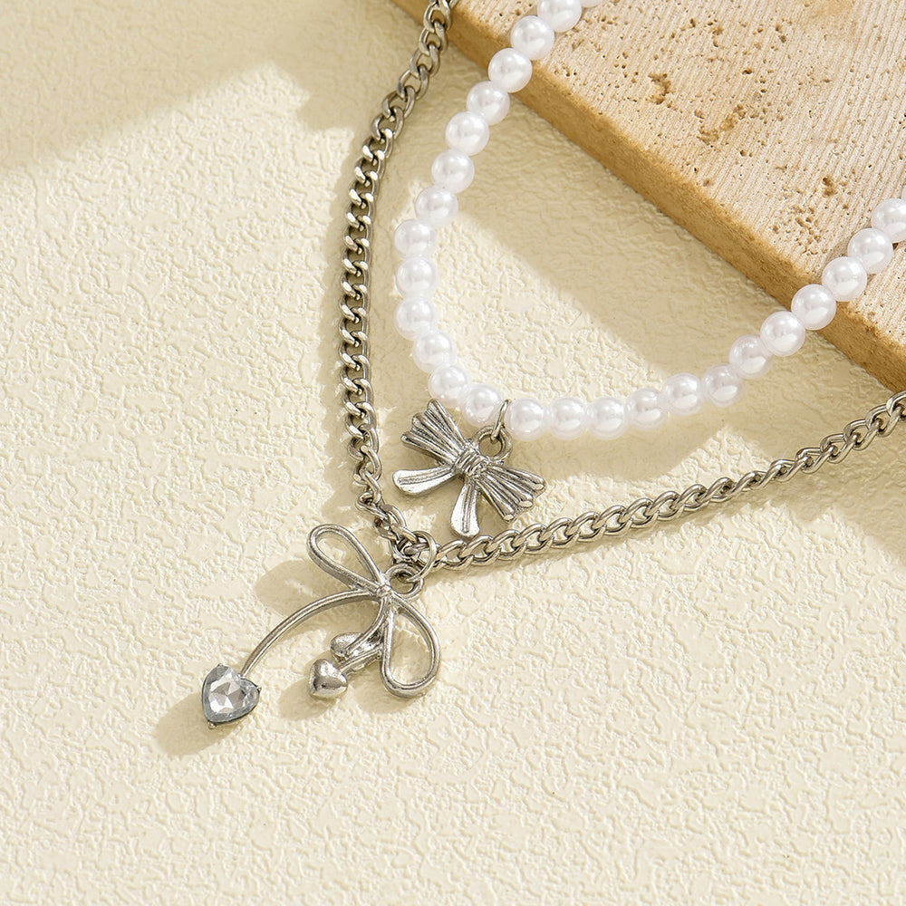 Sweater chain long wholesale european and american cross-border autumn and winter bow pendant stacking simple accessible luxury niche pearl necklace