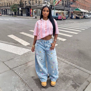 European and american style women's light blue washed denim wide-leg jeans with rhinestone embellishments, high waist, shiny detailing, and a relaxed, floor-sweeping fit