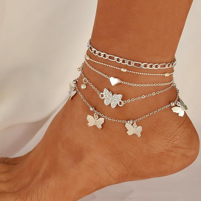 "instagram-worthy, understated luxury anklet set featuring butterfly, shell, and seed beads. available in gold and white gold."
