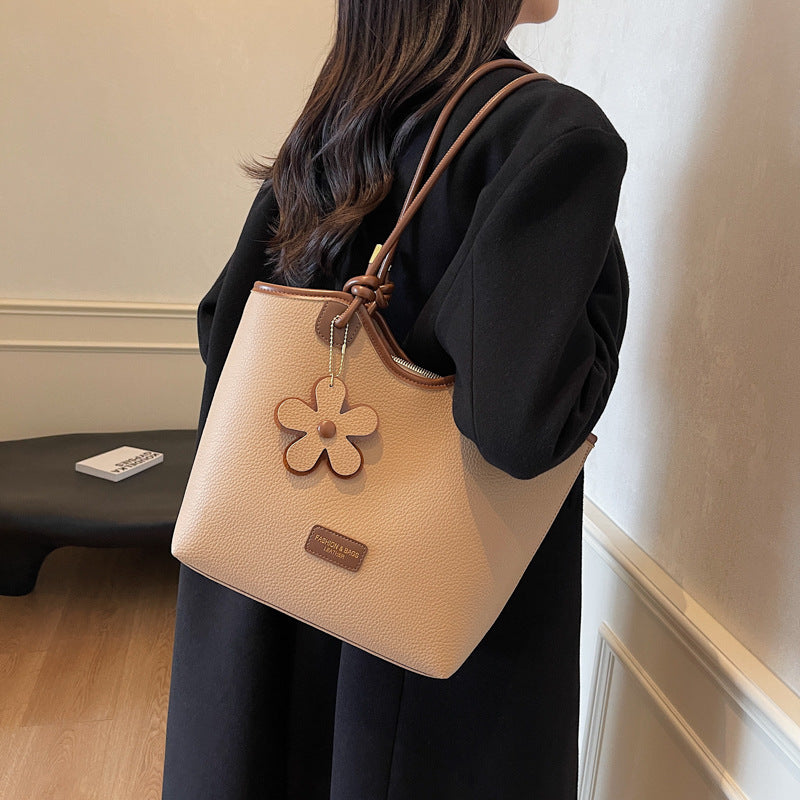 Hand carry versatile bucket bag women's bag 2025 new fashion texture shoulder bag casual foreign style messenger bag