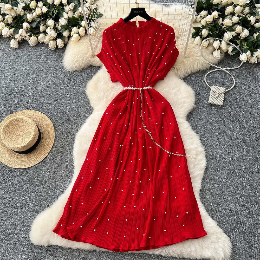 French-inspired v-neck floral chiffon dress with flared sleeves, tie waist, and a figure-flattering, vintage-inspired silhouette