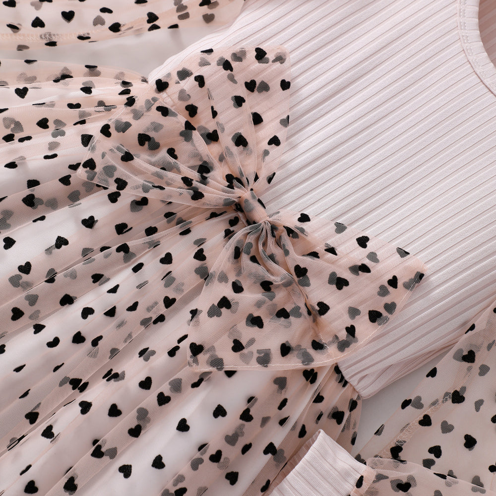 Girls' dress for toddlers and young children, featuring a bow, heart, and polka dot mesh skirt