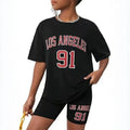 Girls' t-shirt and shorts set featuring a cartoon short-sleeve design and printed graphics, perfect for casual streetwear