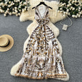Bohemian vacation style retro deep v-neck tie-up sleeveless cinched waist elegant printed ruffle hem dress