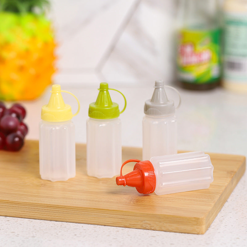 Four-piece seasoning set: transparent sauce dispenser bottles for outdoor bbq, kitchen spice jars, and condiment containers