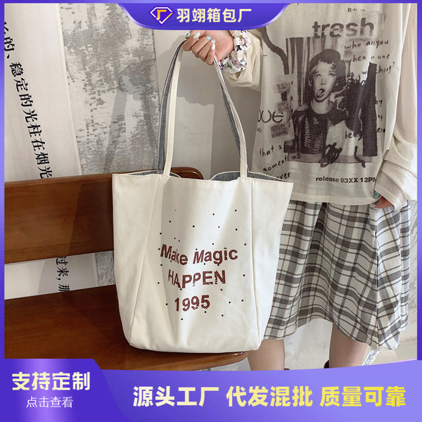 Cross-border letter large-capacity canvas bag women's 2025 new summer fashion printing student class shoulder tote bag
