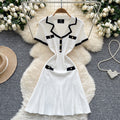 French chic chanel-inspired color block knit dress with peter pan collar, metal buckle waist, and slimming fit