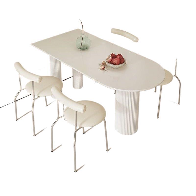 Creamy white rock slab dining table and chair set - modern minimalist semi-circular dining table for small spaces