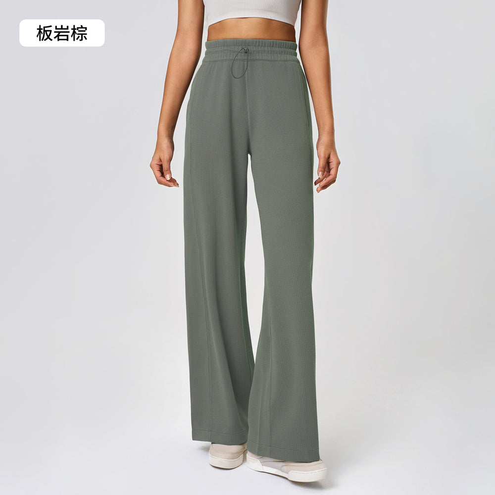 High-waisted, straight-leg pants with a drawstring waistband. versatile and casual, these long pants are designed to elongate the legs with a relaxed, wide-leg fit. perfect for running and workouts. style d25048
