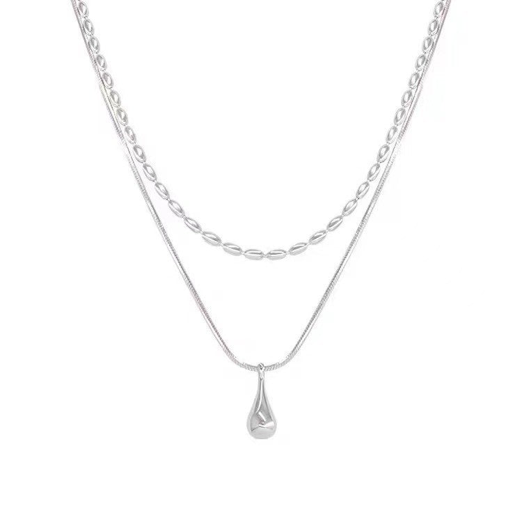 Fashionable, understated luxury: a delicate, double-layered teardrop titanium steel necklace for women. a versatile, minimalist collarbone chain that's trendy, stylish, and fade-resistant