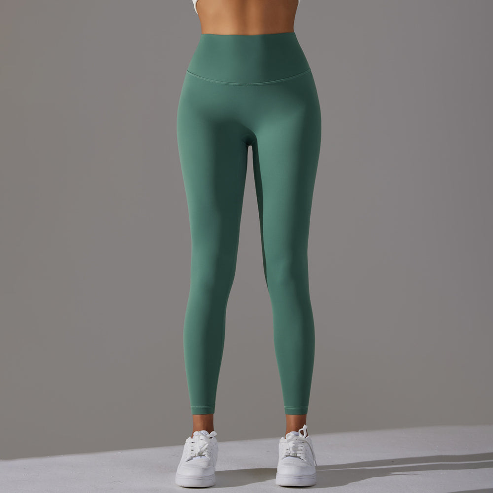 High-waisted, barely-there yoga pants for women, designed with a no-ride-up waistband for a seamless look. these figure-hugging, peach-shaped leggings offer a lift and a comfortable, stretchy fit, perfect for workouts and fitness activities. custom manufa