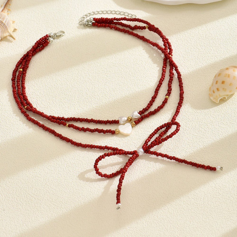 European and american cross-border red beaded bow necklace - luxury, unique design, stackable heart pearl jewelry necklace