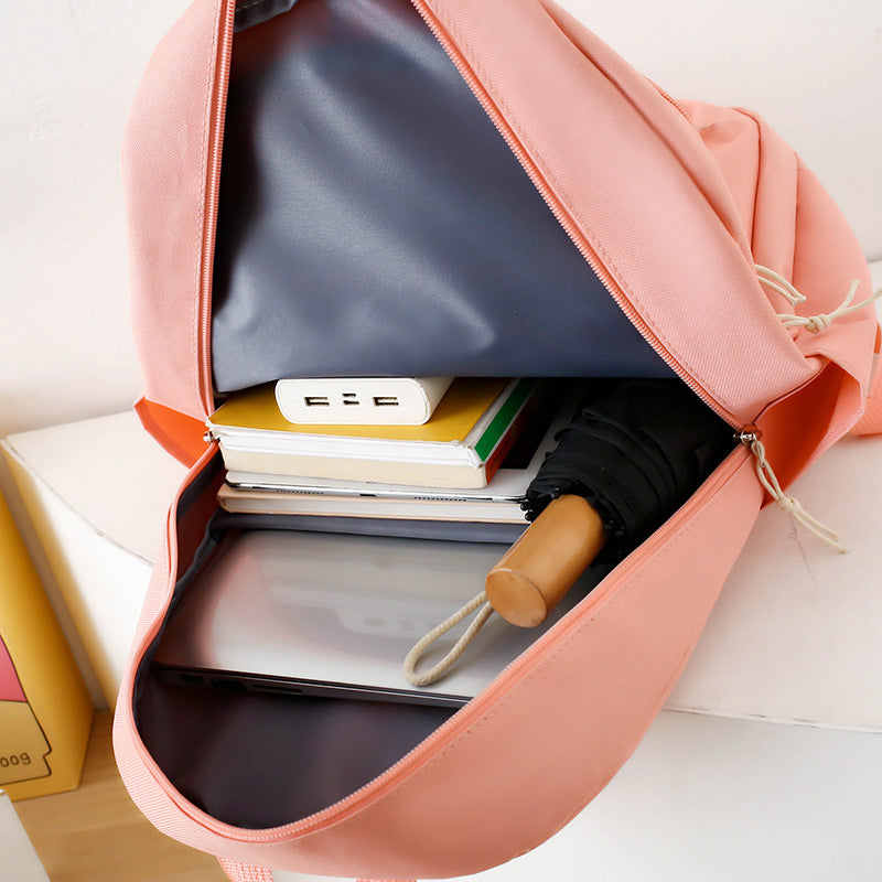 School bag, light for junior high school students, four-piece set for primary school students, large-capacity Korean version backpack, new backpack in 2025.
