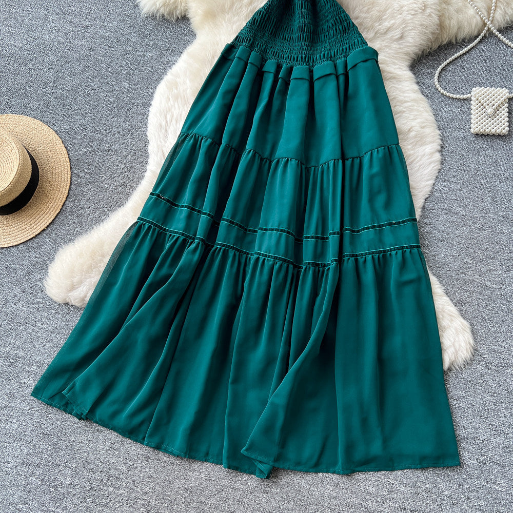 French-inspired, strapless, and stylish dress for women. high-waisted, slimming, and featuring a flattering ruffle hem. perfect for summer, this long, flowing dress comes in a chic green