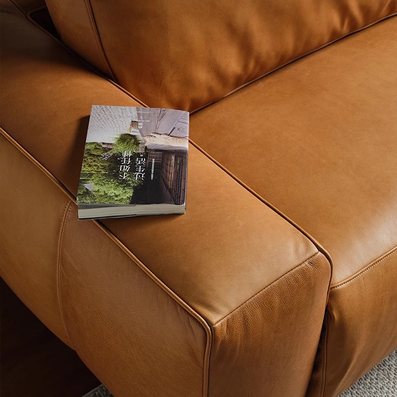 Foshan-made genuine leather electric recliner sofa, perfect for small apartments. this adjustable italian-style straight-row sofa is ideal for living rooms and home theaters