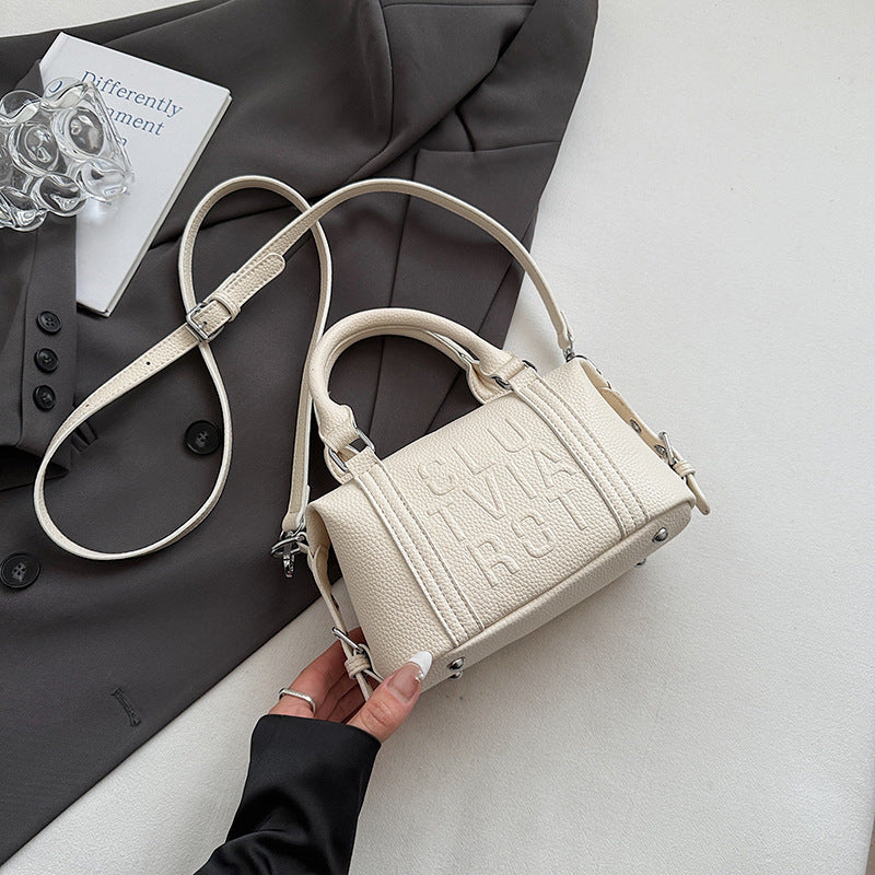 Fashion niche high-end sense embossed letter pillow bag 2025 new summer versatile color casual messenger bag