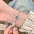 Cat's eye stone broken silver beaded bracelet