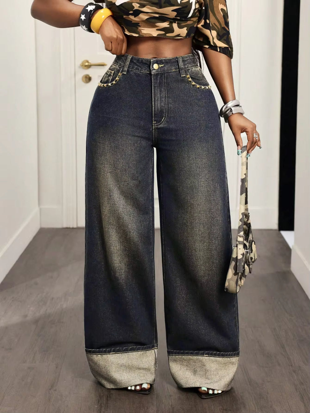 European and american style women's high-waisted vintage distressed washed denim jeans with pocket studs, patchwork, rolled hems, and wide leg, floor-length trousers