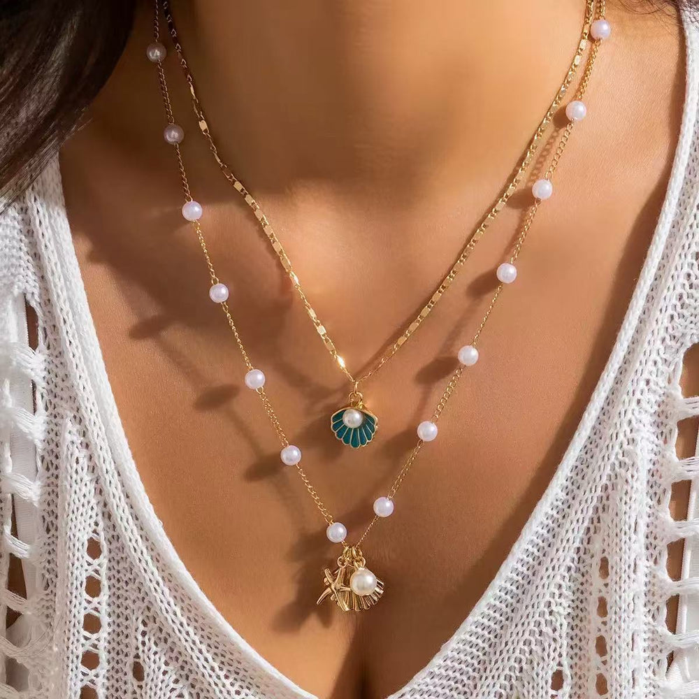 European and american cross-border jewelry: ocean-themed metal starfish and seashell necklace set with designer faux pearl chain